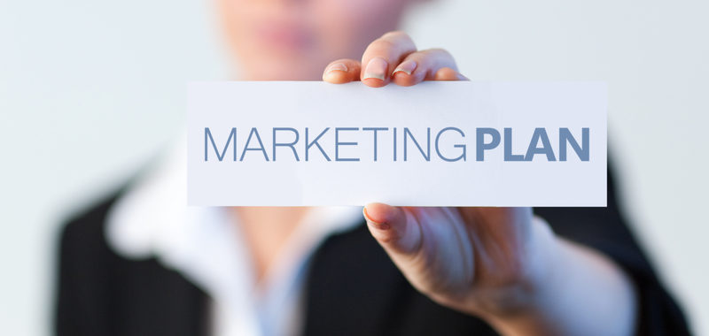 woman holding content marketing plan sign