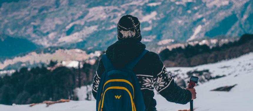 Man on mountain walking on the wild side
