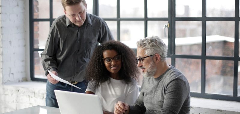 happy workers discuss content marketing