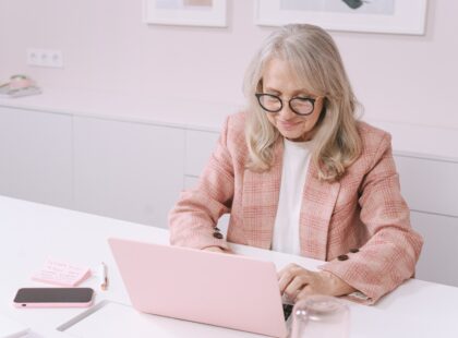 Woman after saying yes sits down at computer to write manuscript